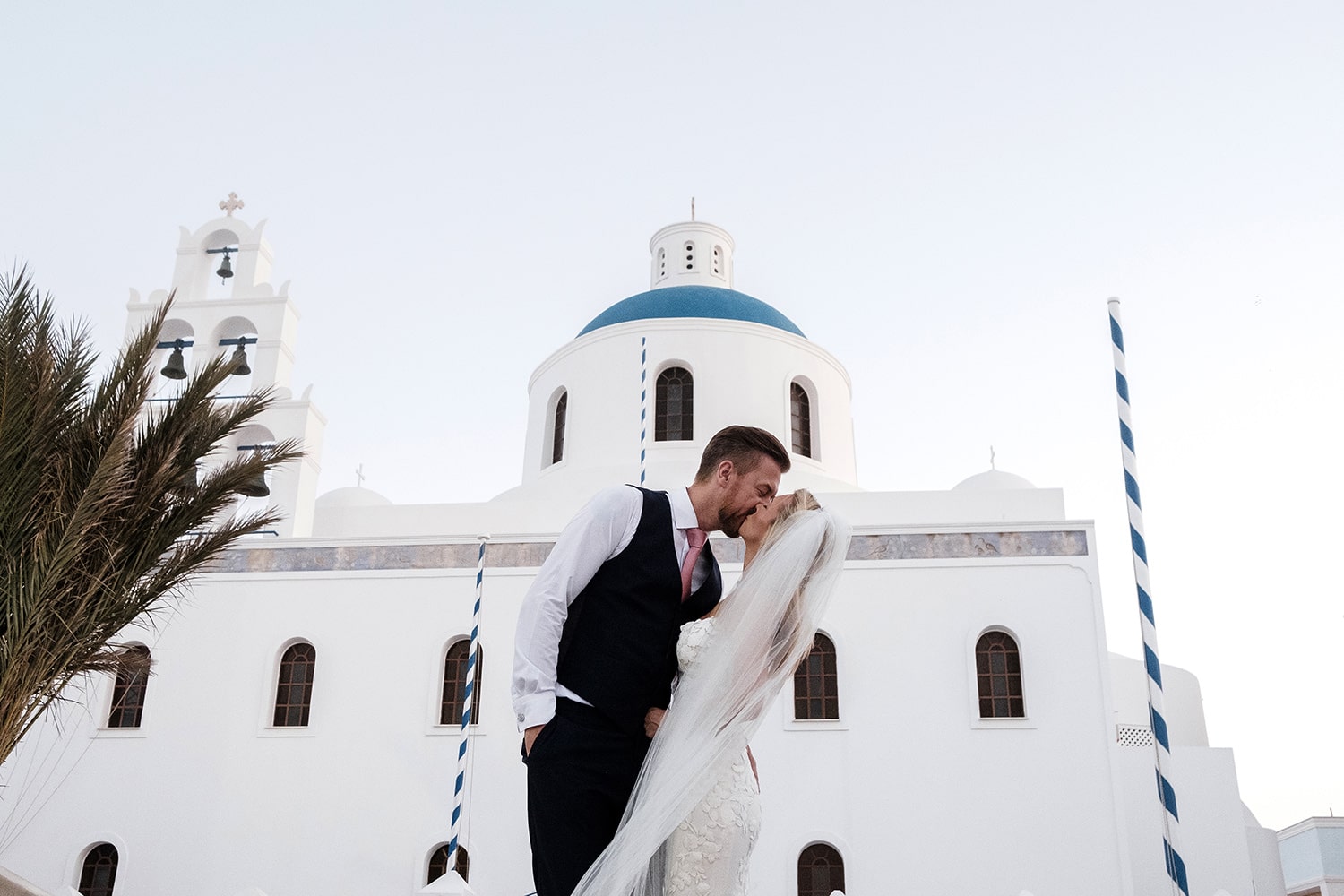 Santorini wedding sunrise kissing