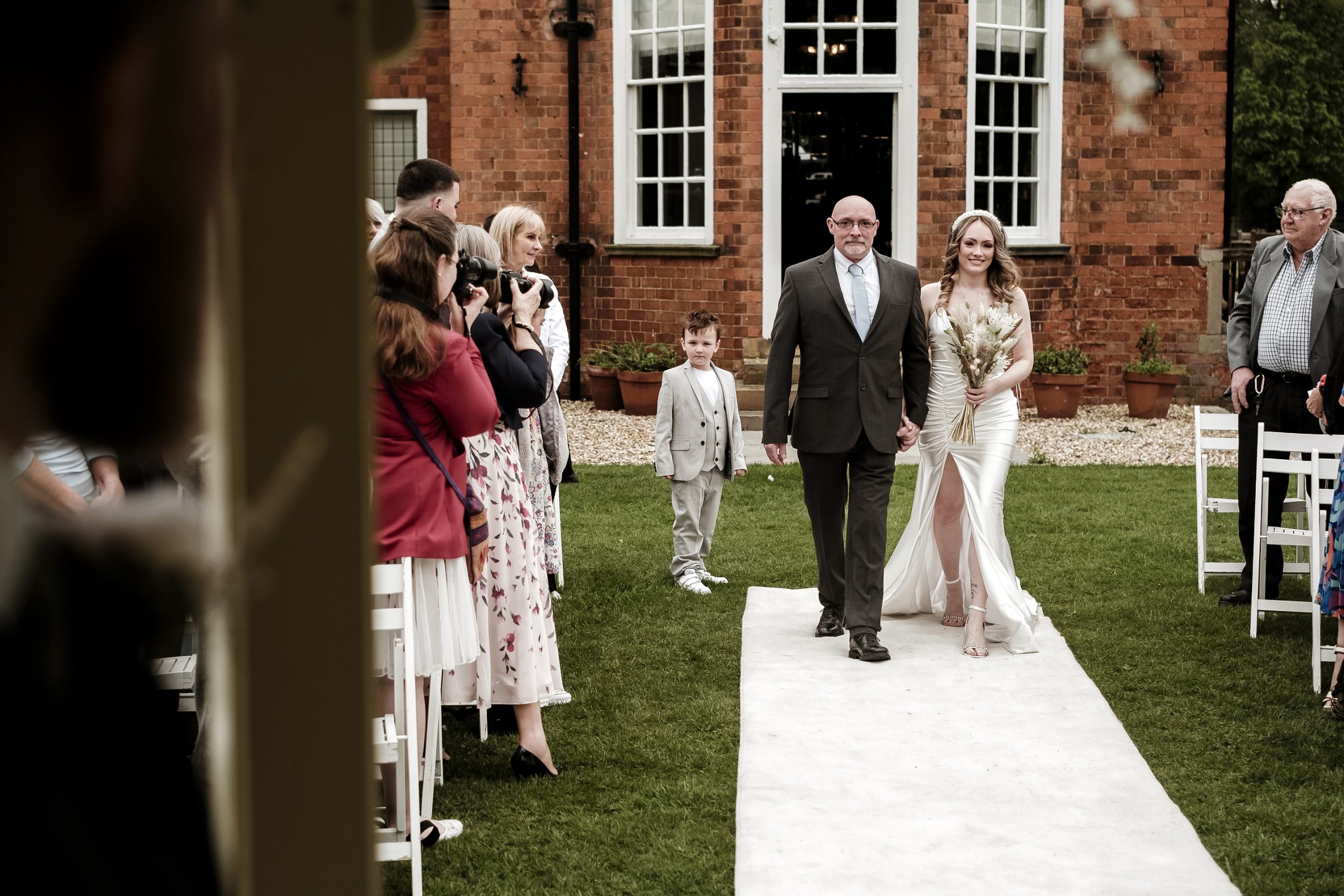 walking down the aisle with daughter and father